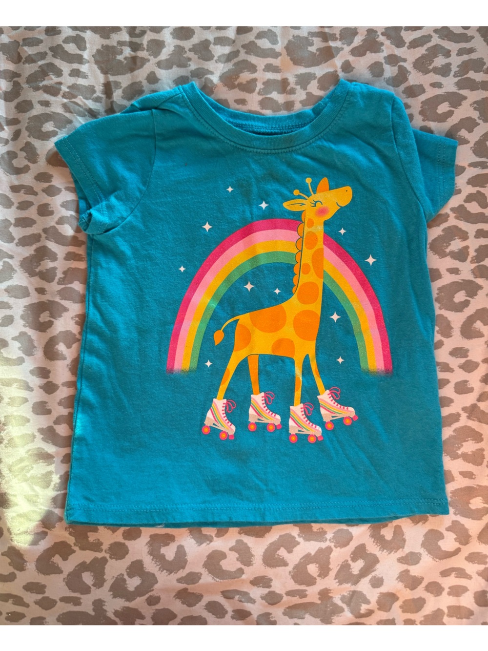 Turquoise Kids Tee with Roller-Skating Giraffe and Rainbow